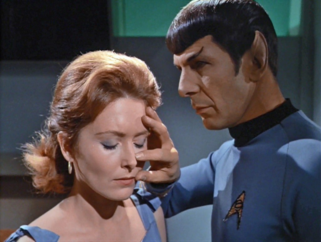 Spock performs a mind meld on a beautiful blonde woman (or IS it a woman??)